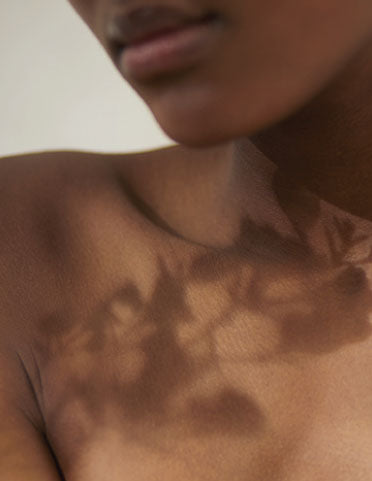Natural shadows reflected on neck and shoulder